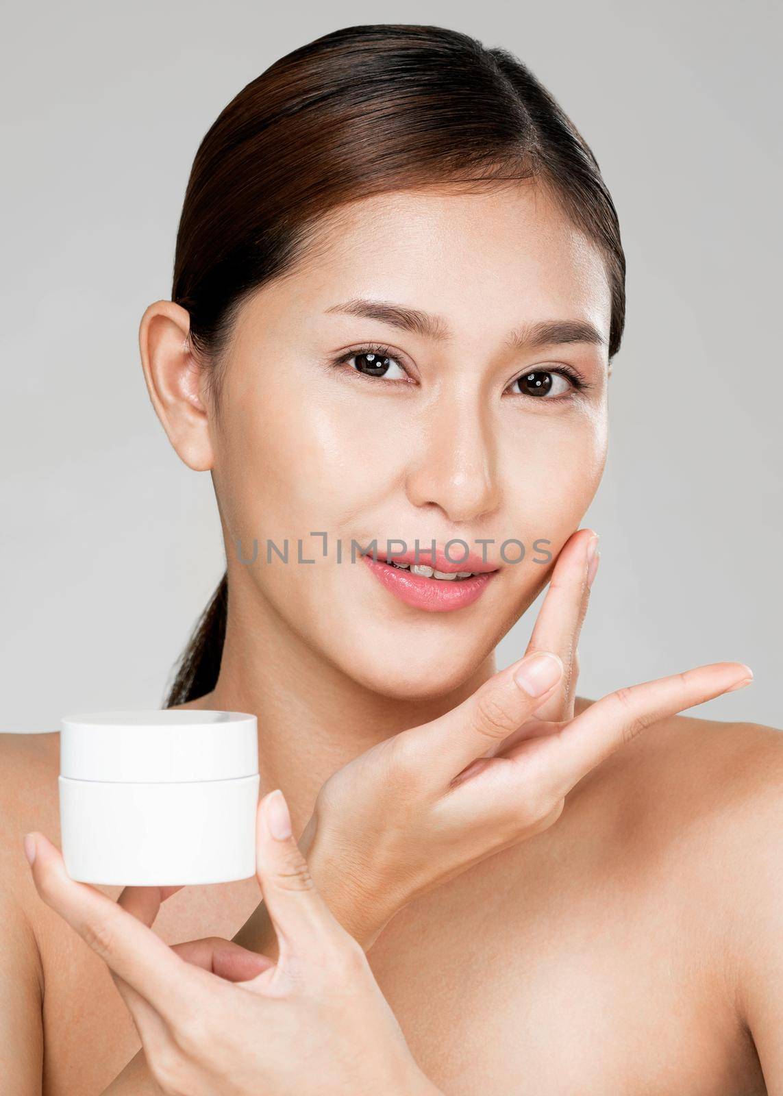 Closeup ardent woman smiling holding mockup product for advertising text place. by biancoblue