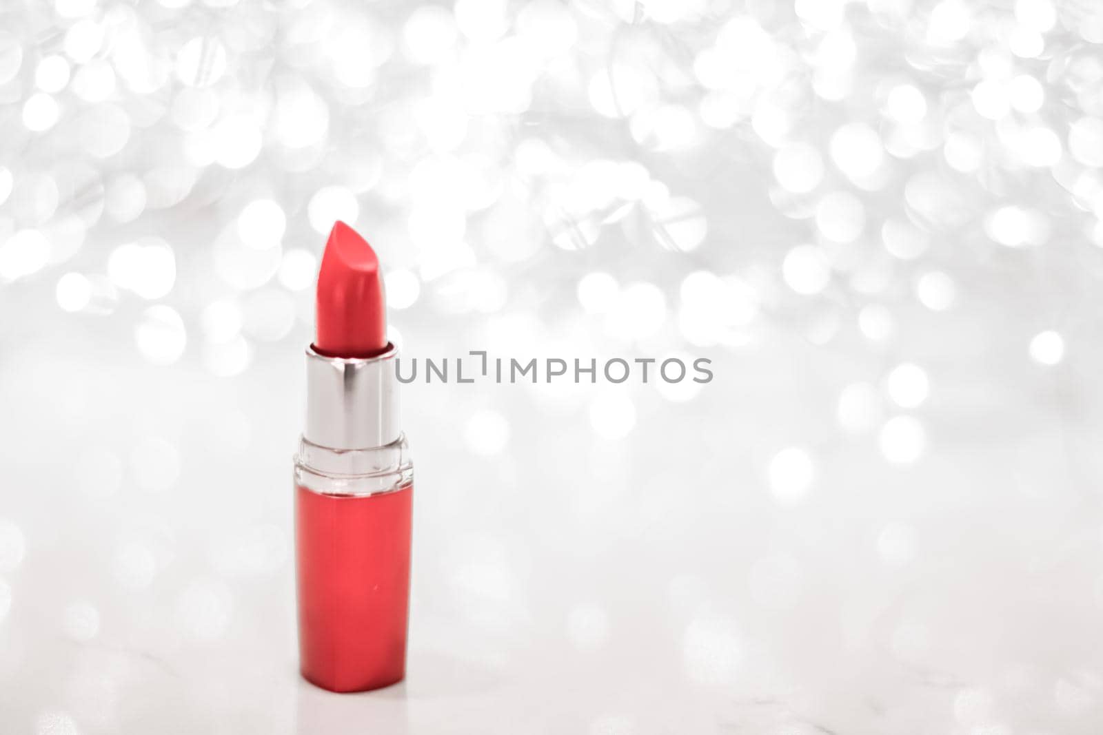 Cosmetic branding, sale and glamour concept - Coral lipstick on silver Christmas, New Years and Valentines Day holiday glitter background, make-up and cosmetics product for luxury beauty brand