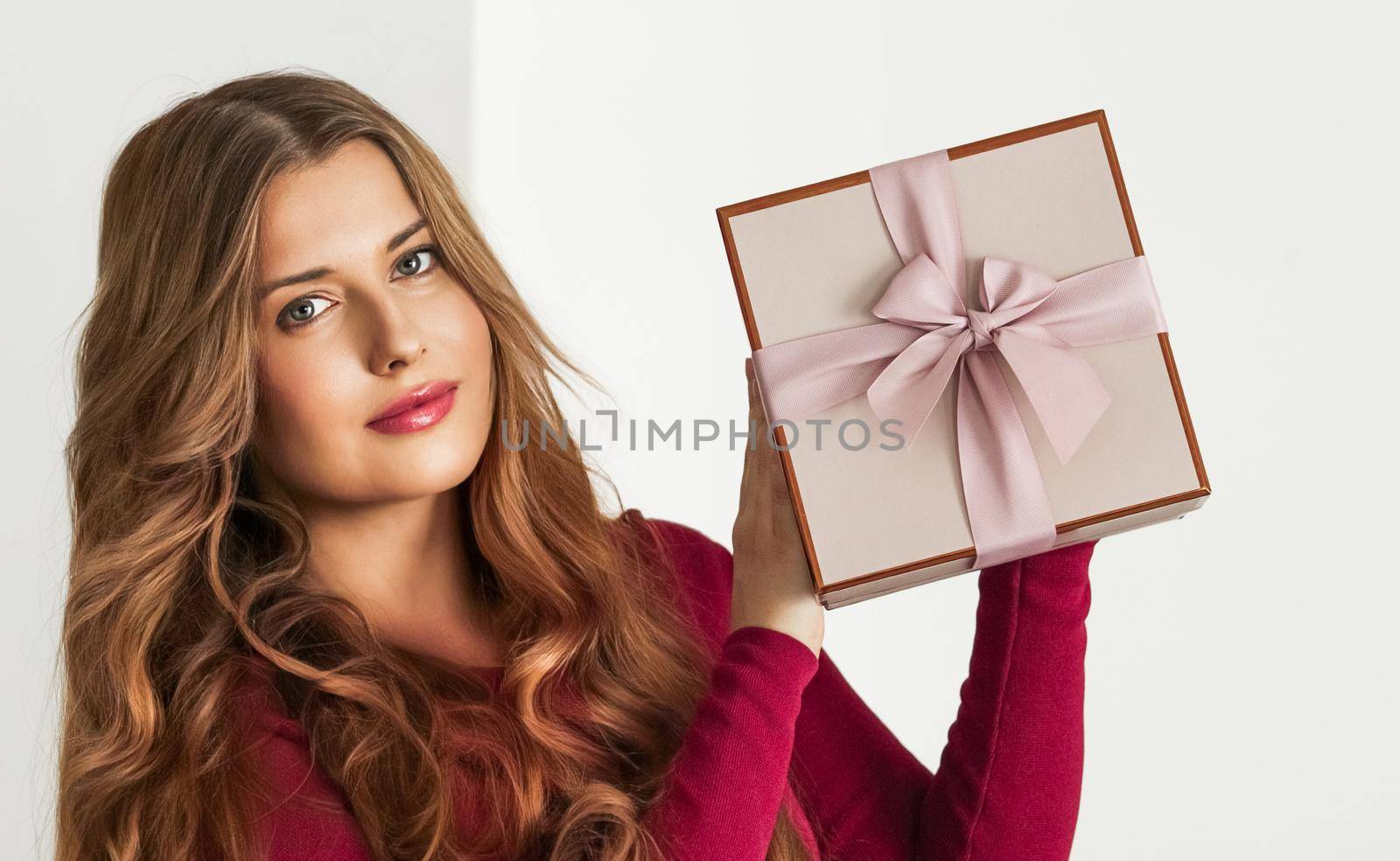 Holiday present for birthday, baby shower, wedding or luxury beauty box subscription delivery, happy woman holding a wrapped pink gift by Anneleven