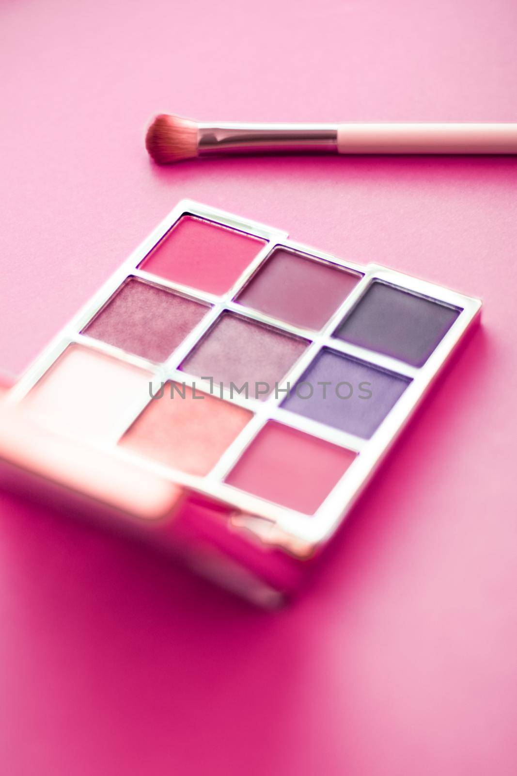 Cosmetic branding, mua and girly concept - Eyeshadow palette and make-up brush on pink background, eye shadows cosmetics product as luxury beauty brand promotion and holiday fashion blog design