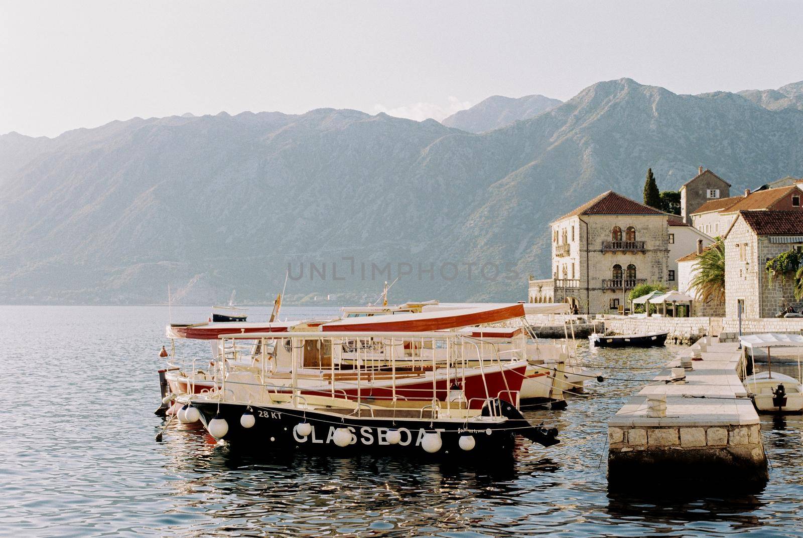 Boats moored at the Perast pier. Montenegro. High quality photo