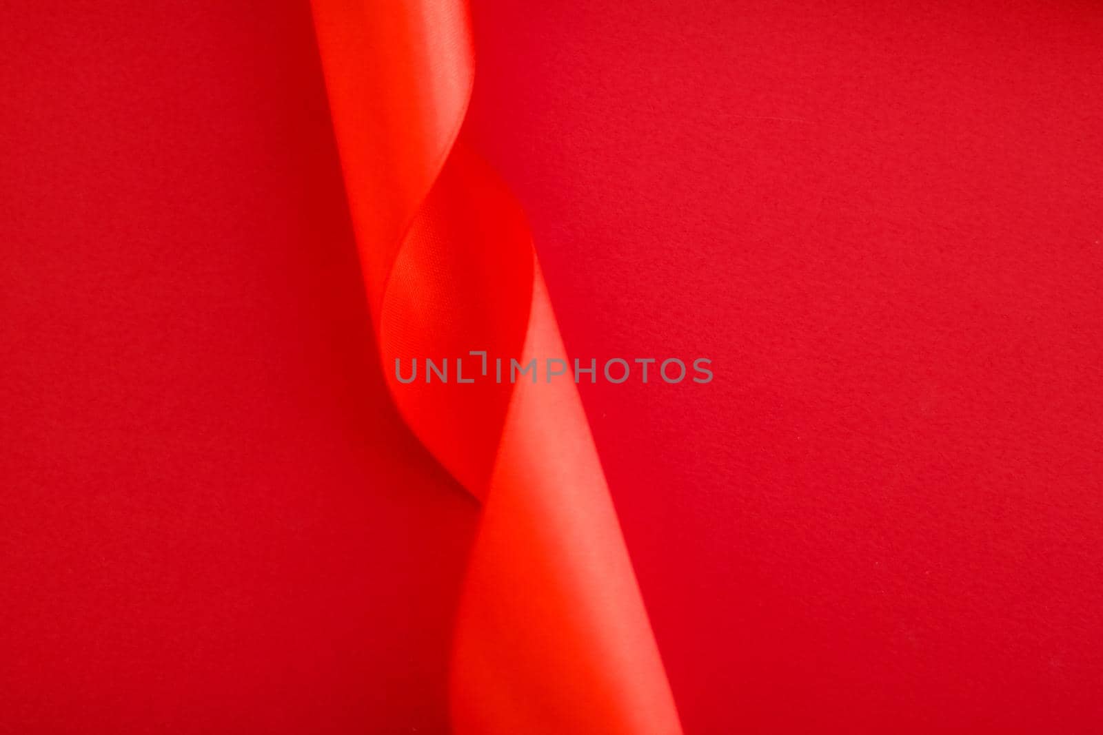 Abstract curly silk ribbon on red background, exclusive luxury brand design for holiday sale product promotion and glamour art invitation card backdrop by Anneleven