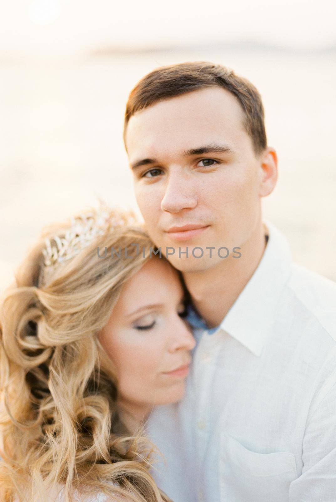 Bride rested her head on the groom shoulder. Portrait. High quality photo