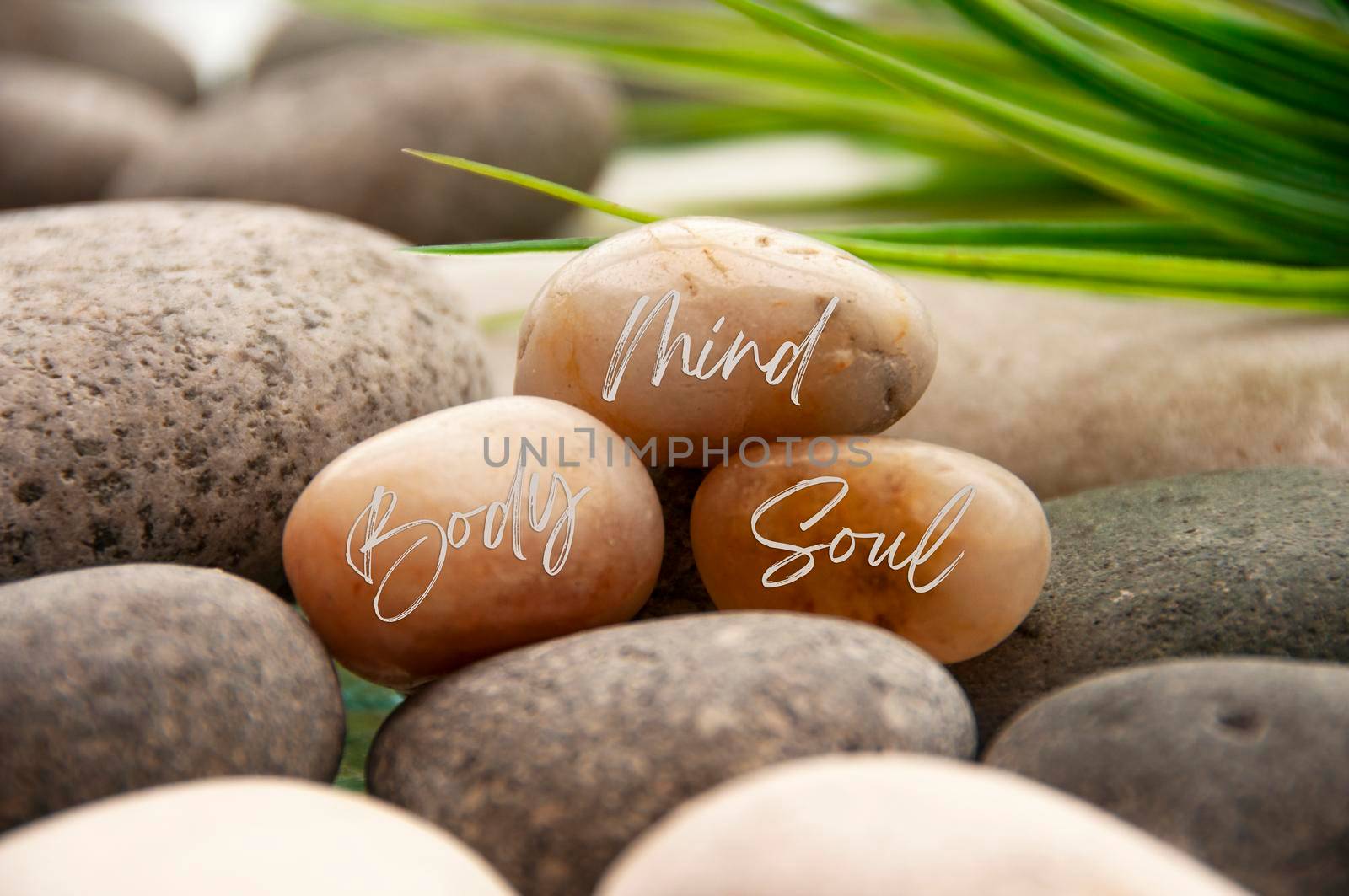 Zen stones with words Mind, Body and Soul with space for text. Copy space and Zen lifestyle