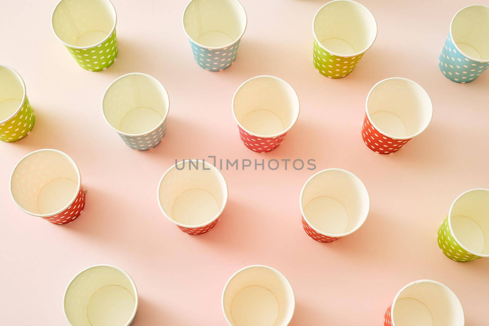 paper fashion cups on a delicate pink background