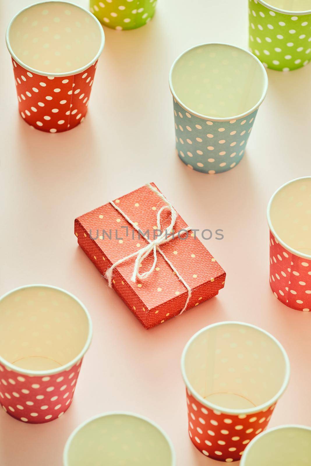 Cups and gift boxes wrapped in polka dots colorful paper