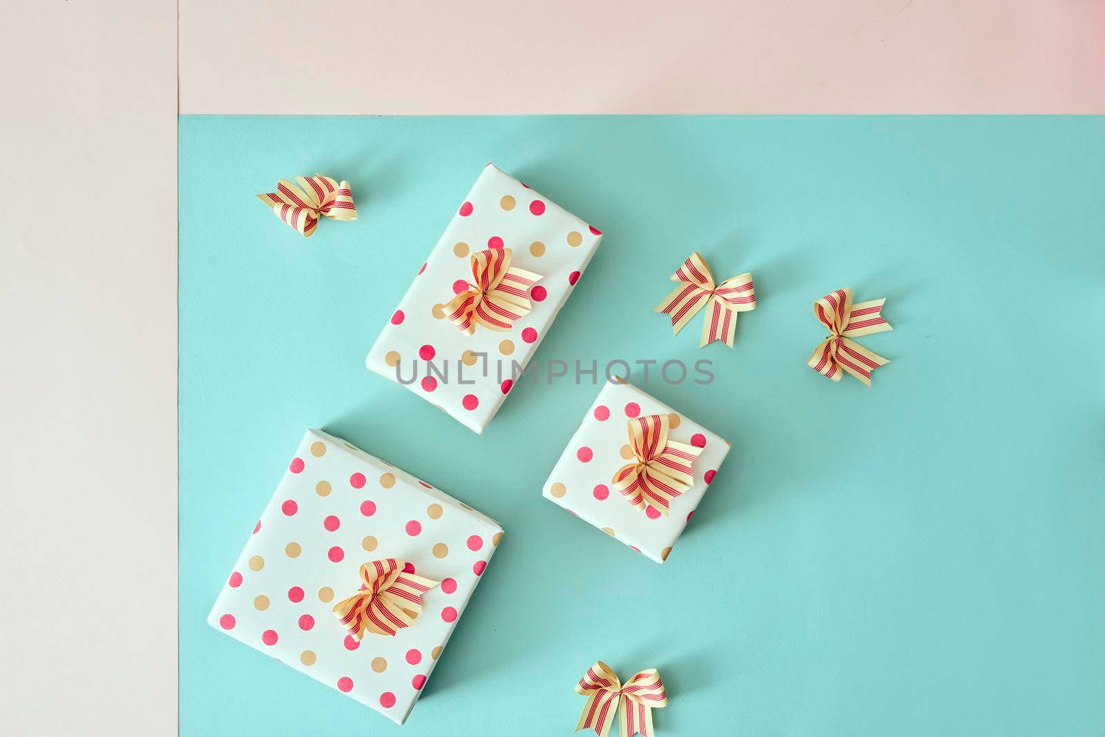 Different colored gift box on color background. by makidotvn