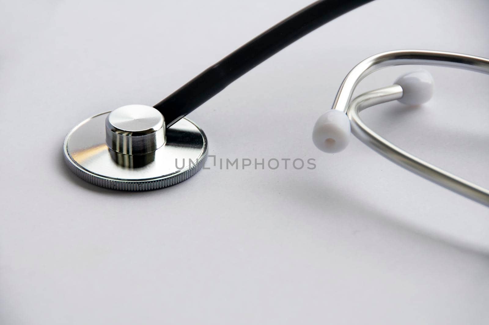 Stethoscope on white cover background with customizable space for text. Copy space and health concept.