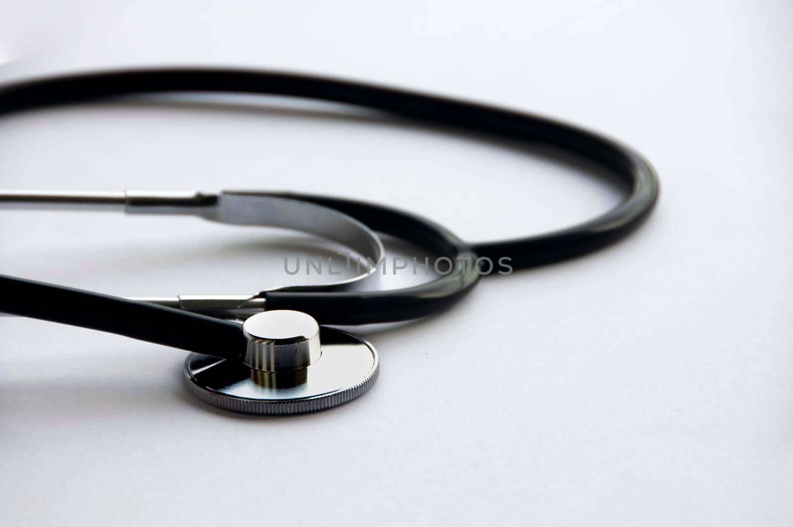 Stethoscope on white cover background with customizable space for text. Copy space and health concept.