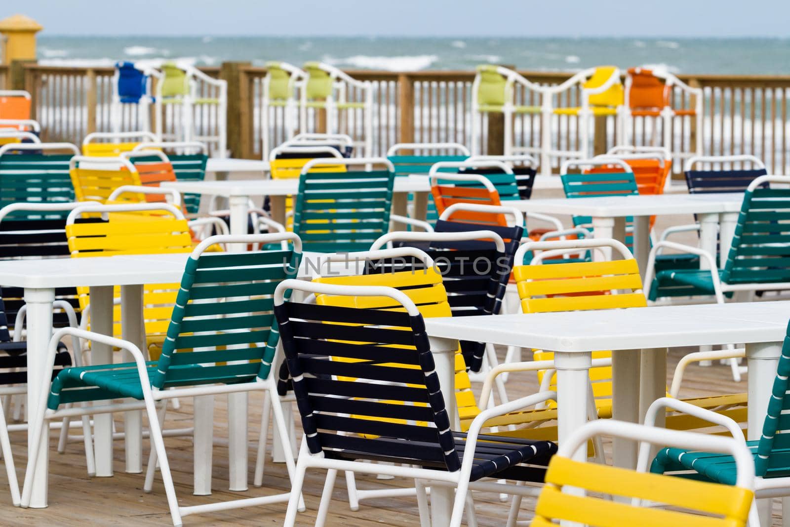 Empty patio with multi color chair.