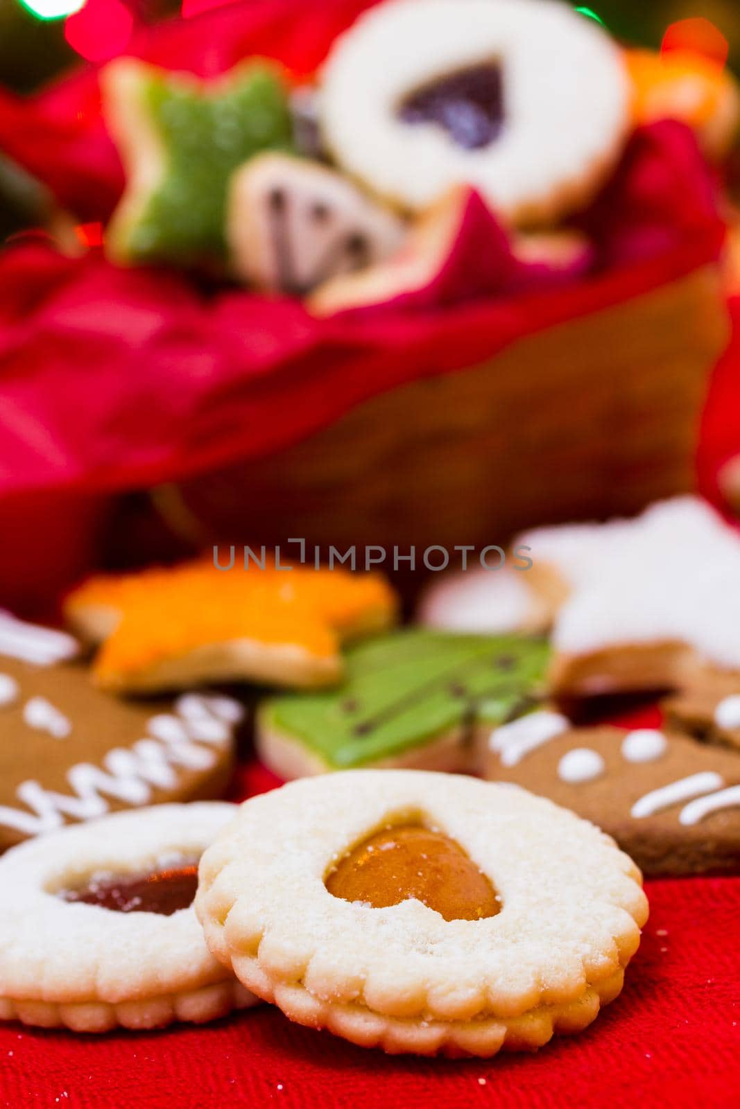Assorted christmas cookies on red background.