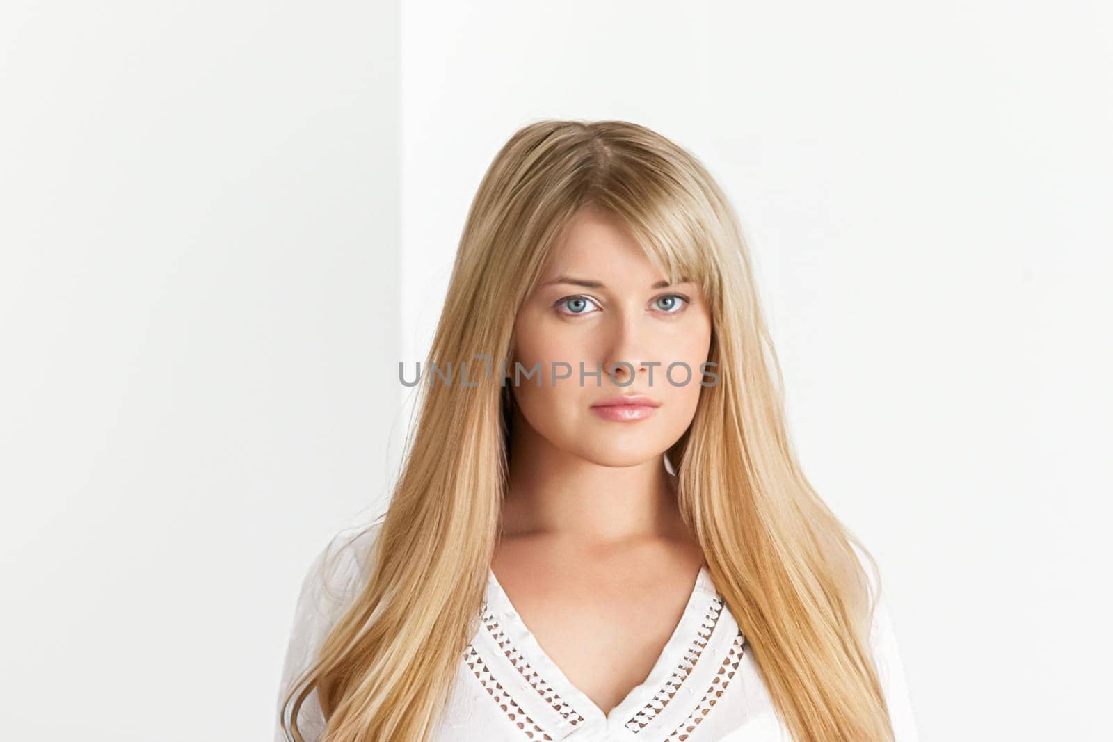 Natural beauty, haircare and feminine hairstyle, face portrait of beautiful woman with long blonde hair on white background, close-up