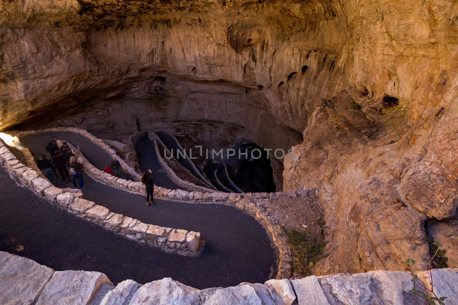 Switchback footpath winds into natural opening of Carlsbad Caverns.