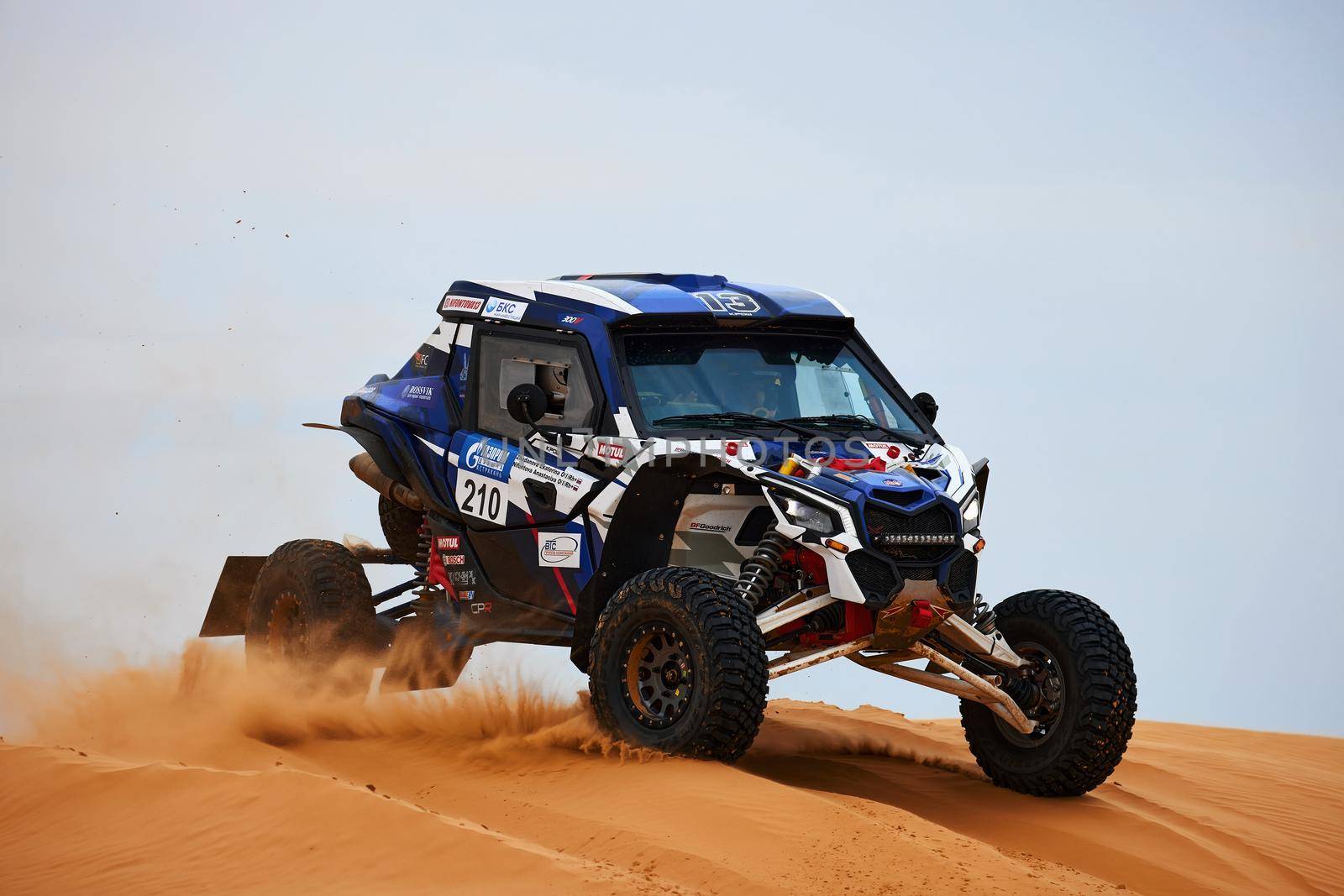 Women's crew at the rally. Sports car gets over the difficult part of the route during the Rally raid THE GOLD OF KAGAN-2021. 26.04.2021 Astrakhan, Russia.