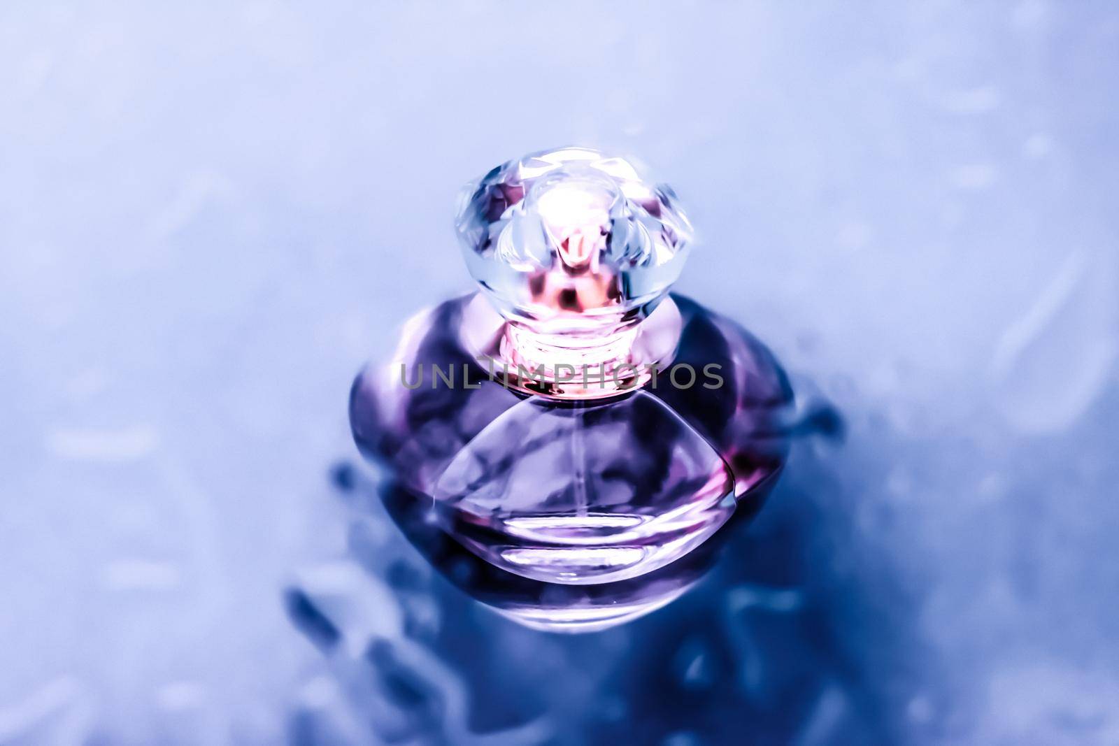 Perfumery, cosmetics and branding concept - Perfume bottle under purple water, fresh sea coastal scent as glamour fragrance and eau de parfum product as holiday gift, luxury beauty spa brand present