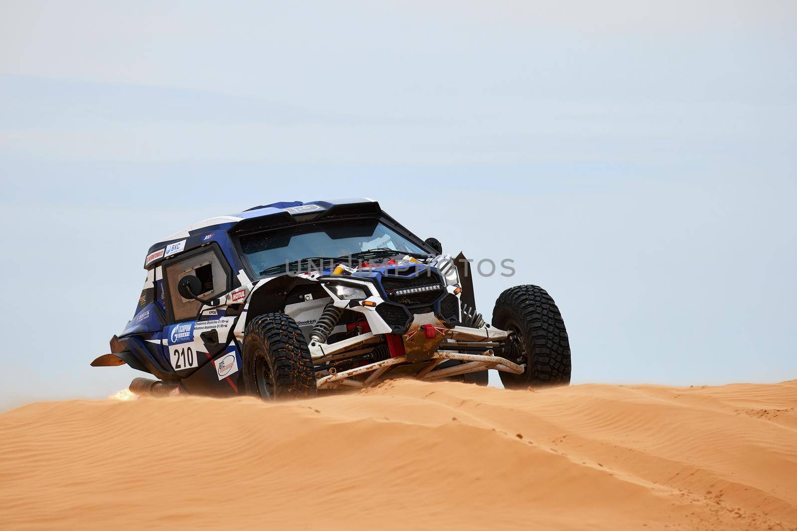 Women's crew at the rally. Sports car gets over the difficult part of the route during the Rally raid THE GOLD OF KAGAN-2021. 26.04.2021 Astrakhan, Russia.
