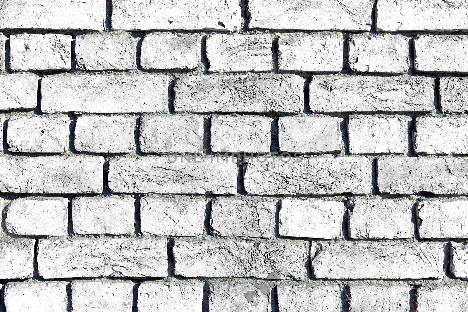 White brick wall. Simple white brick wall with light gray shades.