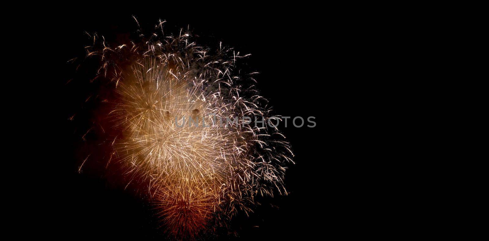 Colorful fireworks of various colors over night sky, Real Fireworks on Deep Black Background Sky on Fireworks festival show before independence day on 4 of July. Beautiful fireworks show.