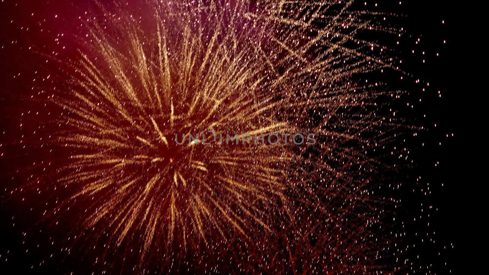 Colorful fireworks of various colors over night sky, Real Fireworks on Deep Black Background Sky on Fireworks festival show before independence day on 4 of July. Beautiful fireworks show.