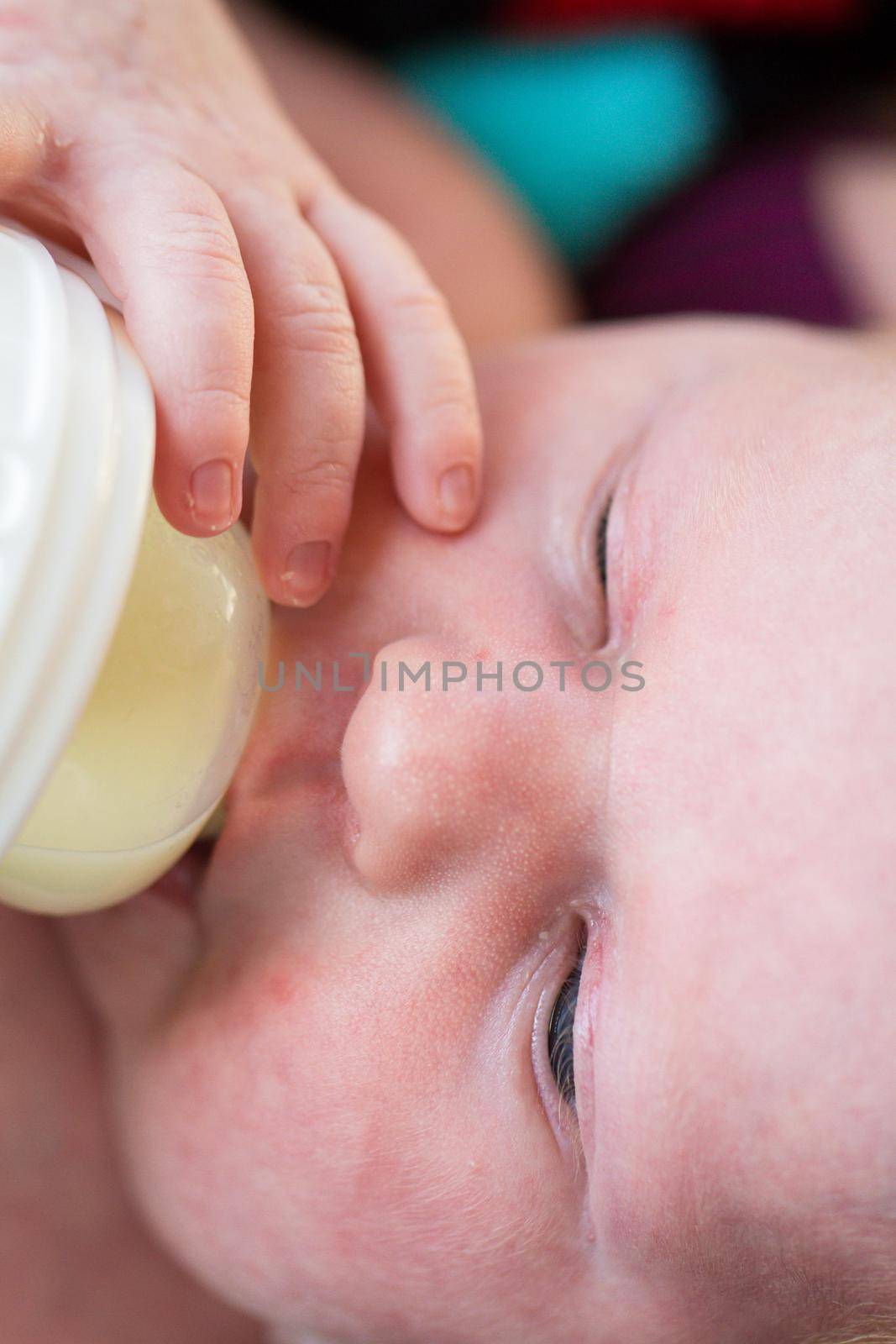 Newborn baby girl at feeding time.