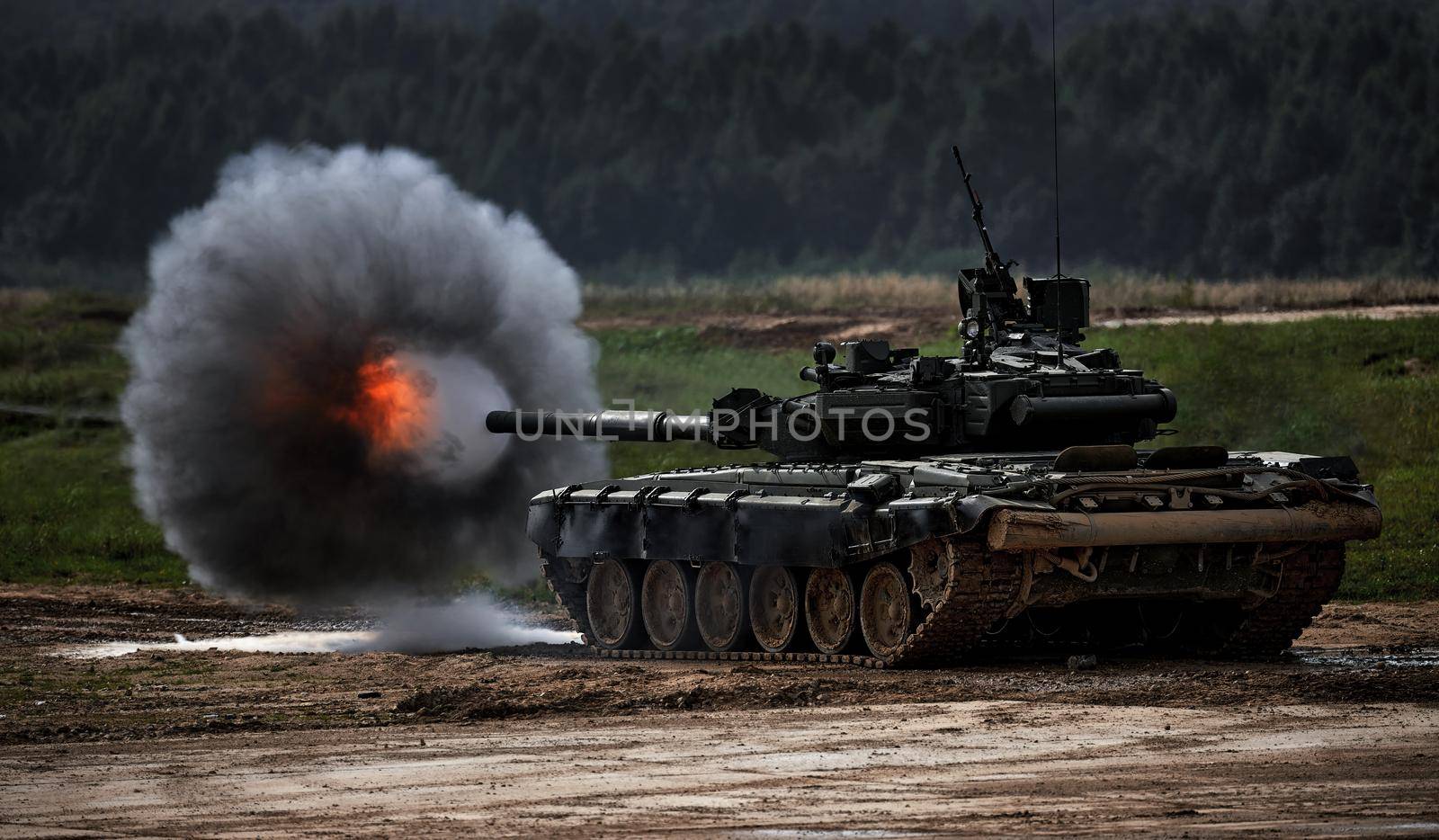 Shot from a tank gun with a smoke ring, the frame of military operations. Russian Modern tank Shooting at a target. Smoke, explosion, military Exercises, Military operations by EvgeniyQW