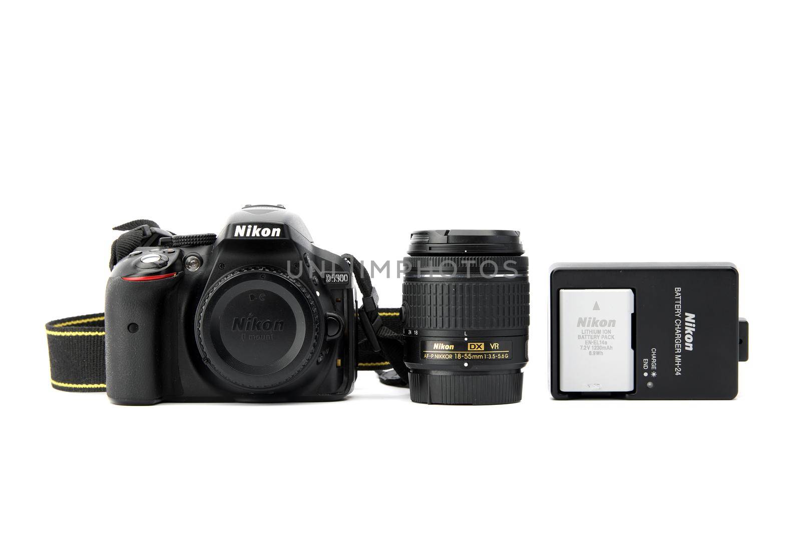 Nikon DSLR Camera Nikon D5300 with whale lens and charger isolated on white background. Detail photos of Nikon D5300 body with grip. 03.04.2021, Rostov region, Russia.