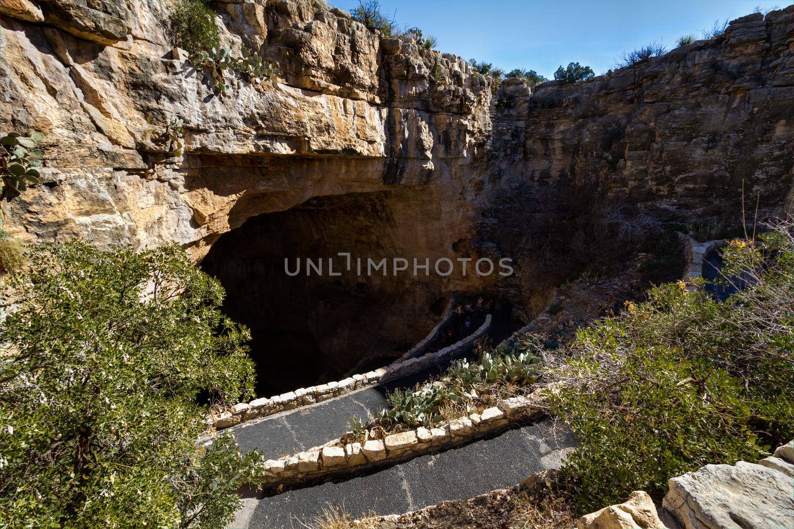 Switchback footpath winds into natural opening of Carlsbad Caverns.