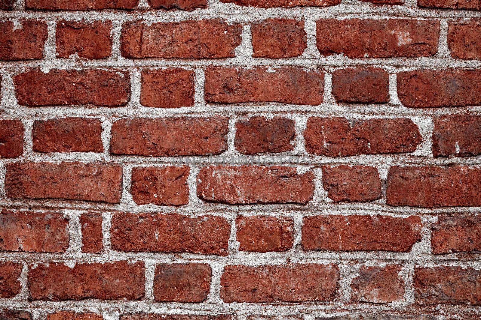 Old brick wall. Horizontal wide red color brick wall background. Vintage house facade