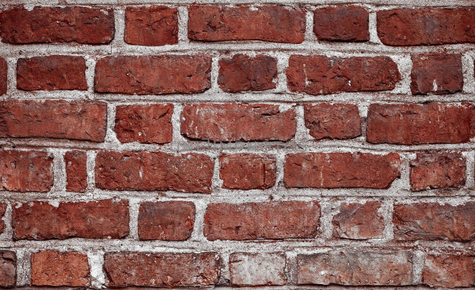 Old brick wall. Horizontal wide red color brick wall background. Vintage house facade