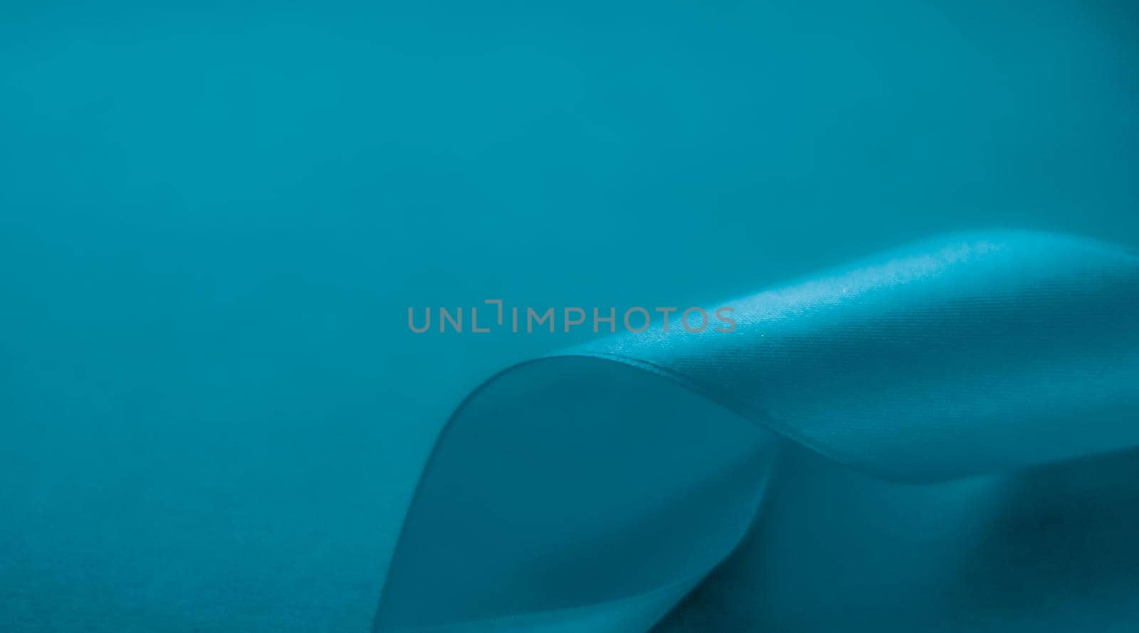 Branding, holidays and luxe brands concept - Abstract silk ribbon on aqua blue background, exclusive luxury brand design for holiday sale product promotion and glamour art invitation card backdrop