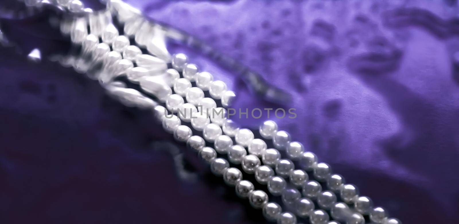 Jewelry, branding and gems concept - Coastal jewellery fashion, pearl necklace under purple water background, glamour style present and chic gift for luxury jewelery brand, holiday banner design