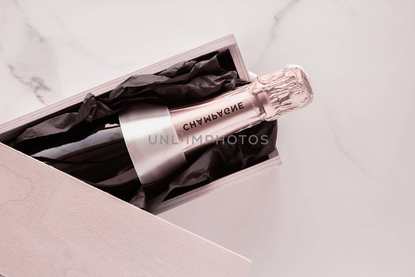 Champagne bottle and gift box on marble, New Years, Christmas, Valentines Day or wedding holiday present and luxury product packaging for beverage brand by Anneleven