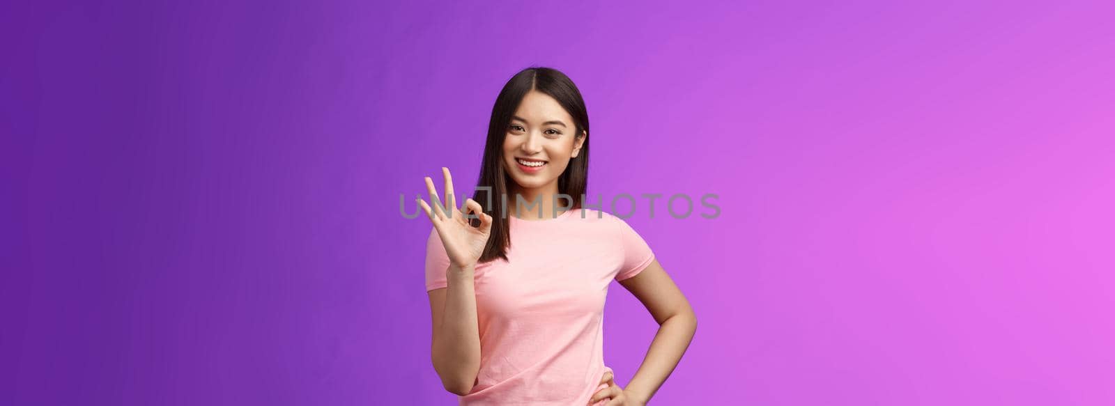 Okay good choice. Tender attractive friendly asian girl shopping together girlfriend, give positive reply, accept good idea, show ok sign, smiling judgemental, approve perfect plan by Benzoix