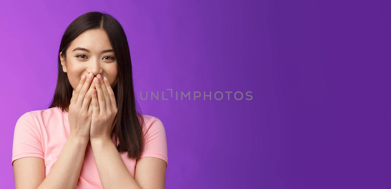 Amused cheerful lovely asian girlfriend blushing happily, hold hands on mouth giggle joyfully, thankful receive cute compliment, stand purple background upbeat, laughing carefree by Benzoix