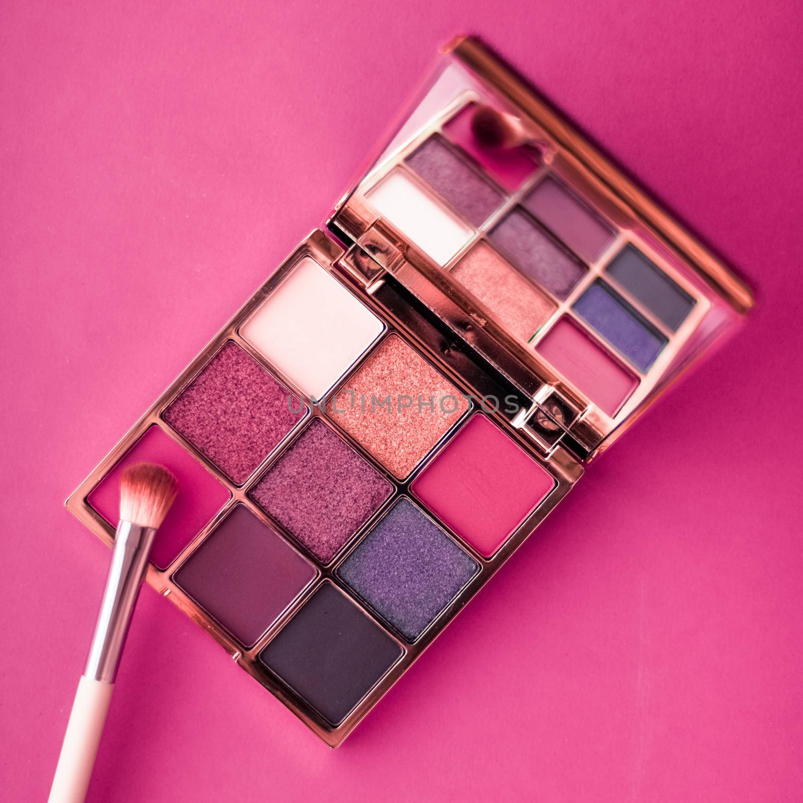 Cosmetic branding, mua and girly concept - Eyeshadow palette and make-up brush on pink background, eye shadows cosmetics product as luxury beauty brand promotion and holiday fashion blog design