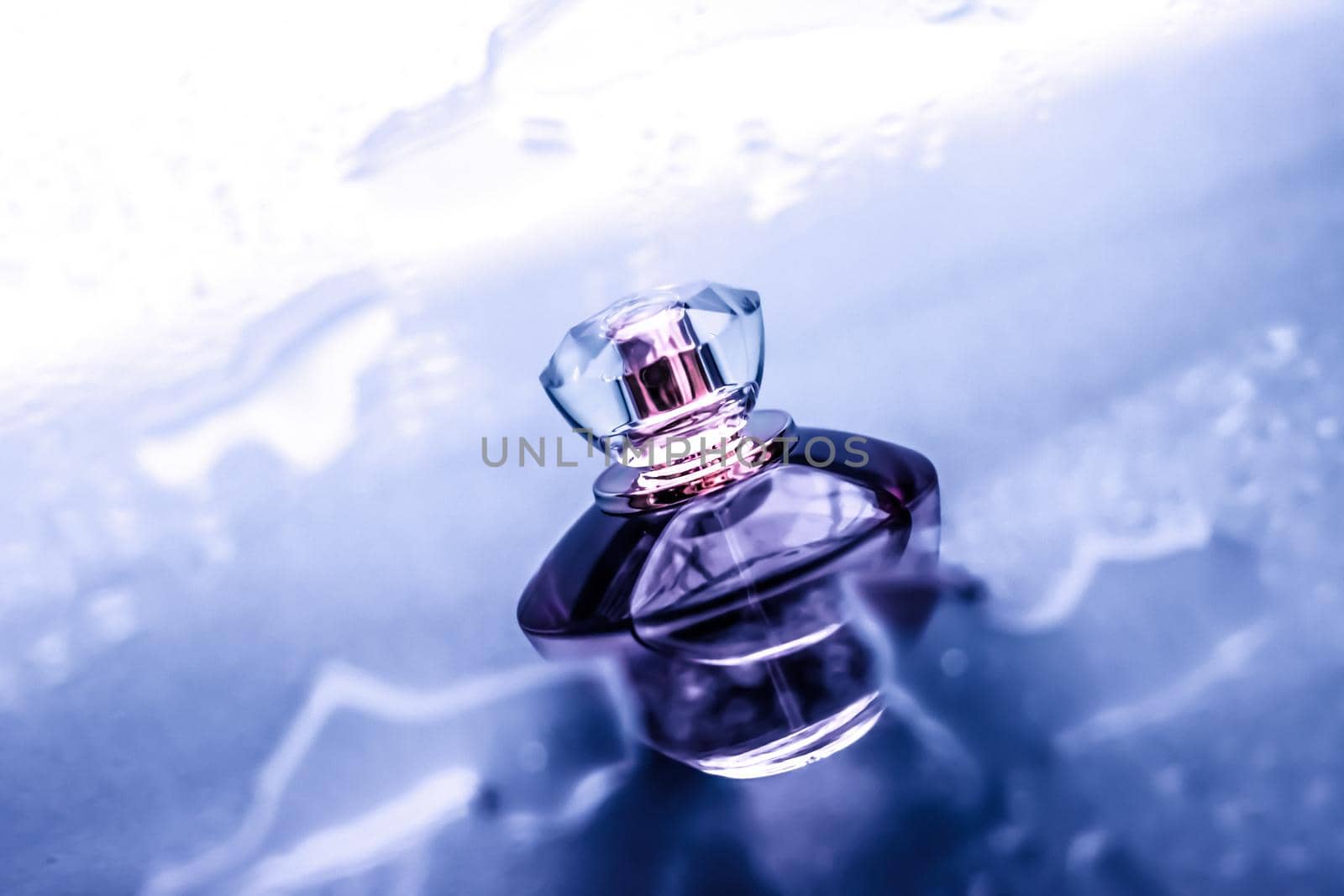 Perfumery, cosmetics and branding concept - Perfume bottle under purple water, fresh sea coastal scent as glamour fragrance and eau de parfum product as holiday gift, luxury beauty spa brand present
