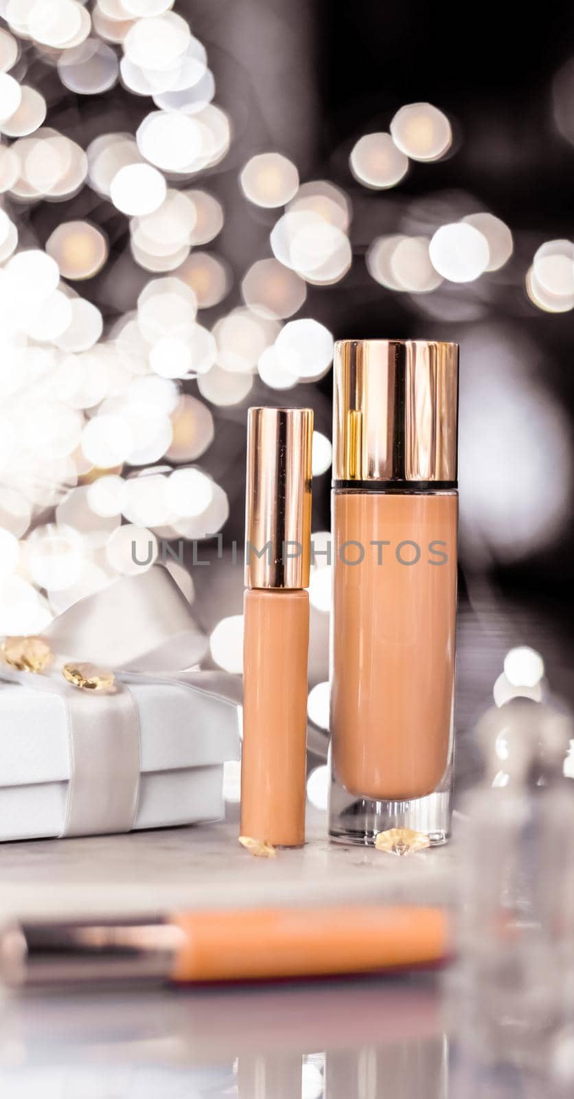 Cosmetic branding, Christmas glitter and girly blog concept - Holiday make-up foundation base, concealer and white gift box, luxury cosmetics present and blank label products for beauty brand design