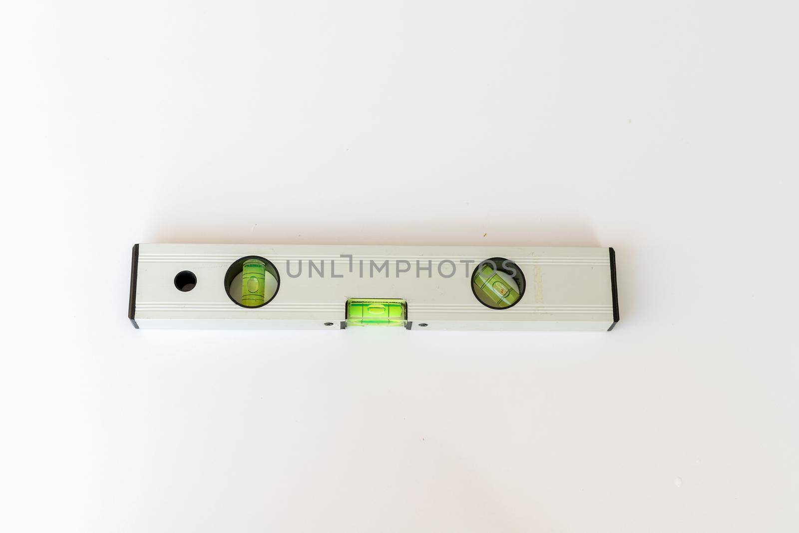 spirit level tool on white isolated background by Bilalphotos