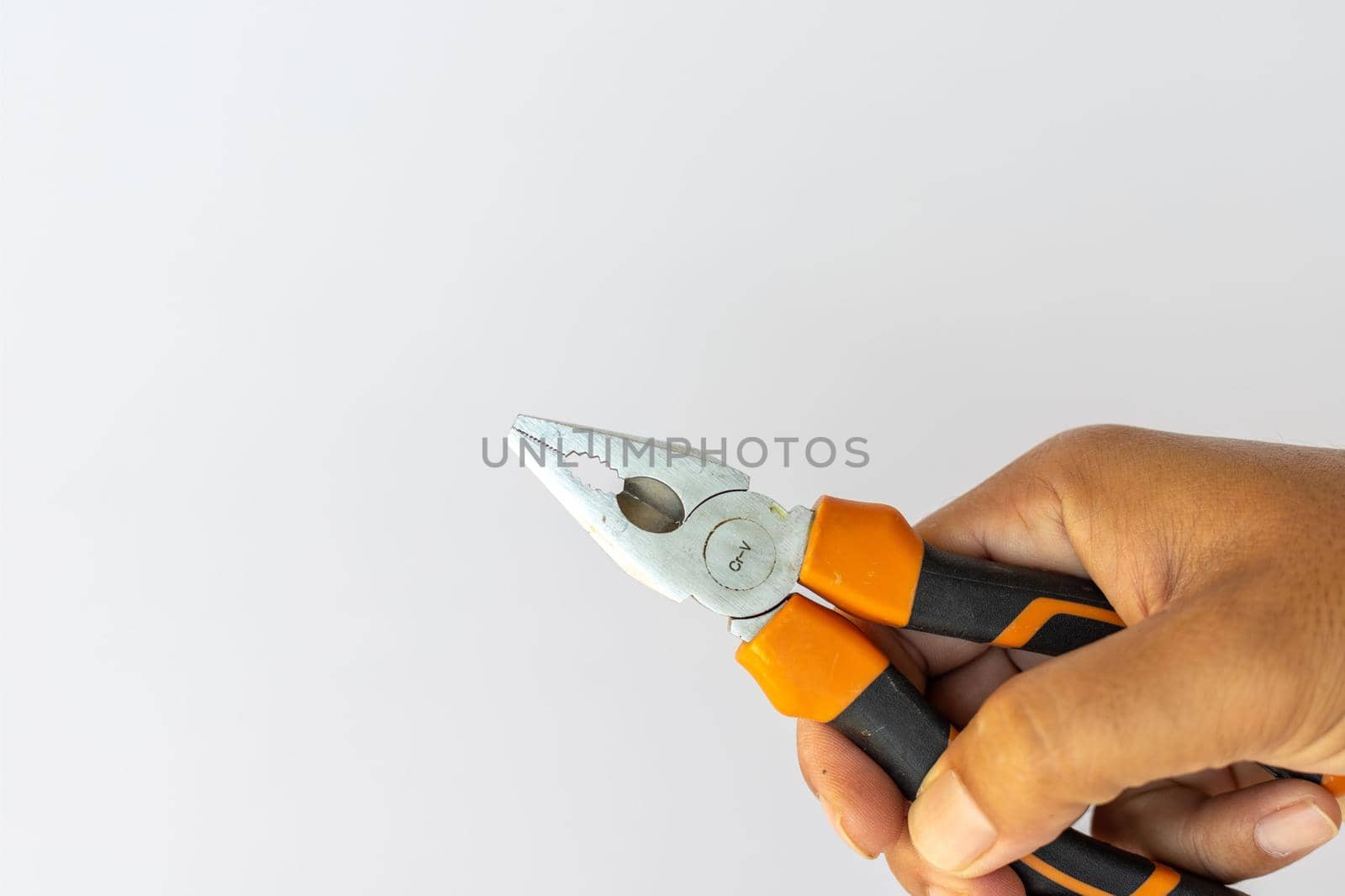 A man holding a working tool holding in hand