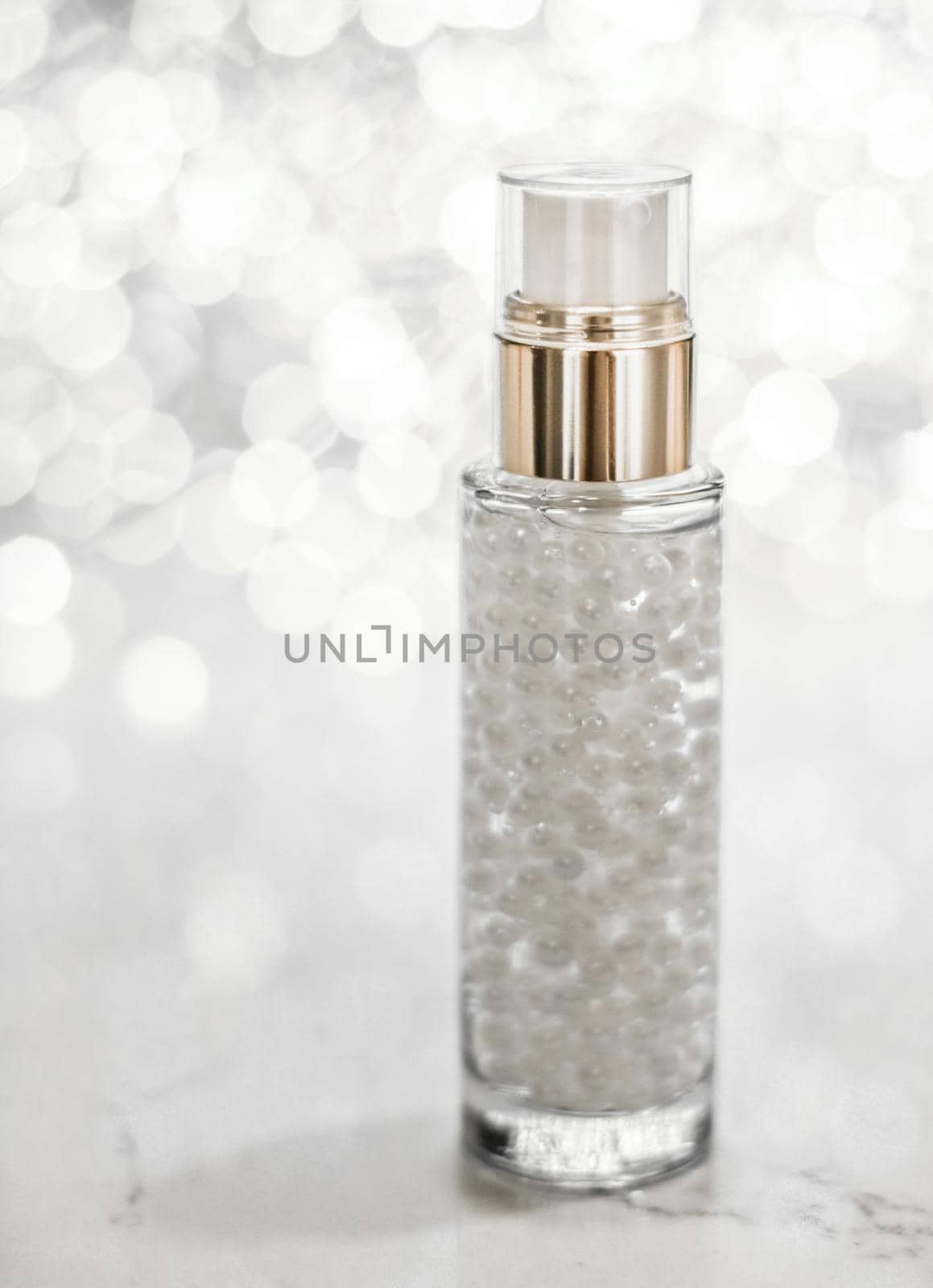 Cosmetic branding, blank label and glamour present concept - Holiday make-up base gel, serum emulsion, lotion bottle and silver glitter, luxury skin and body care cosmetics for beauty brand ads