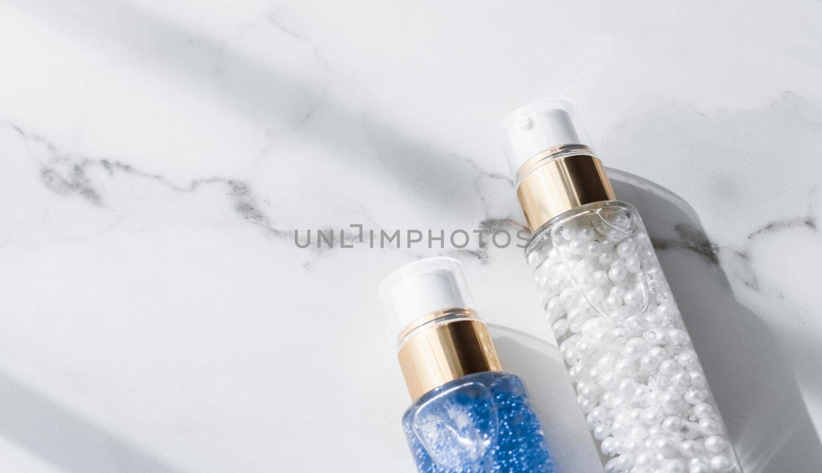 Cosmetic branding, packaging and make-up concept - Skin care serum and gel bottle, moisturizing lotion and lifting cream emulsion on marble, anti-age cosmetics for luxury beauty skincare brand design