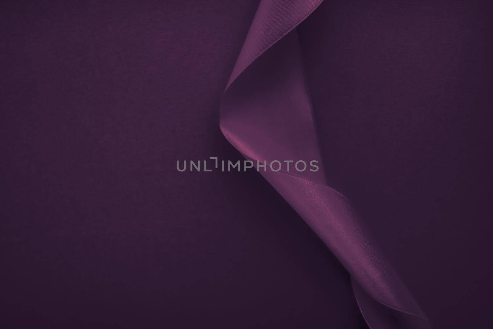 Branding, holidays and luxe brands concept - Abstract curly silk ribbon on purple background, exclusive luxury brand design for holiday sale product promotion and glamour art invitation card backdrop