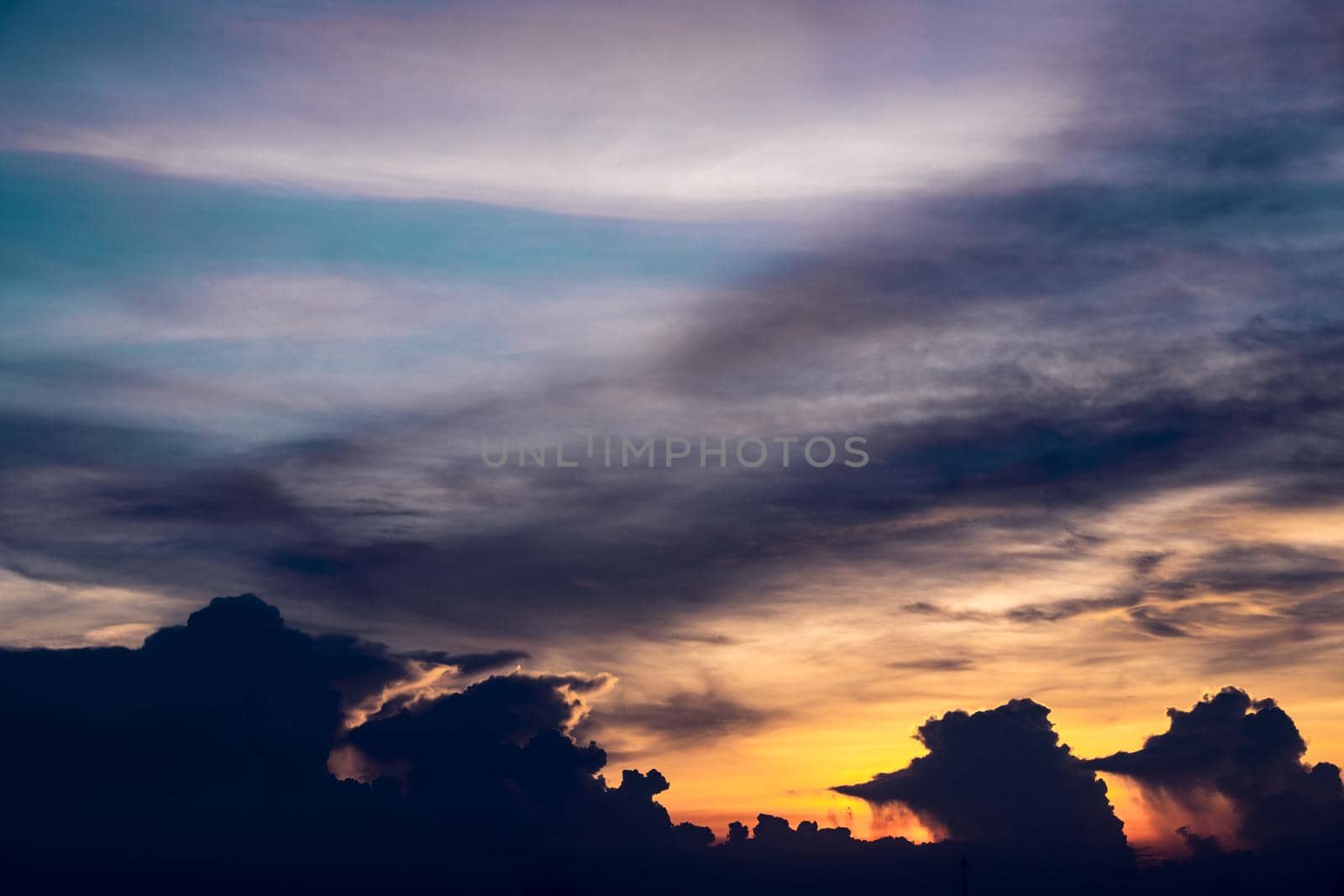 nature orange sunset sky with cloud in rain season abstract background by Petrichor