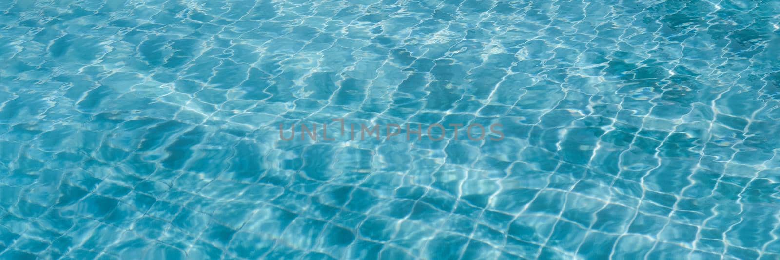 Abstract background Patterns Ripped water Surface swimming pool Light Reflection Vibrant blue green.