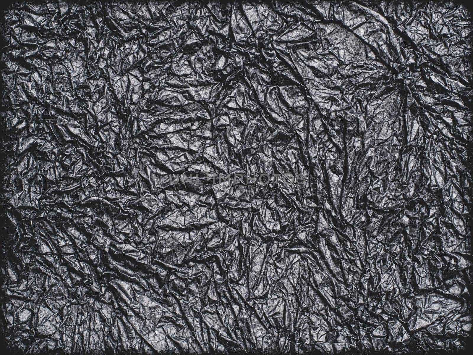 Crumpled paper for background image. Paper texture, a sheet of black wrinkled paper