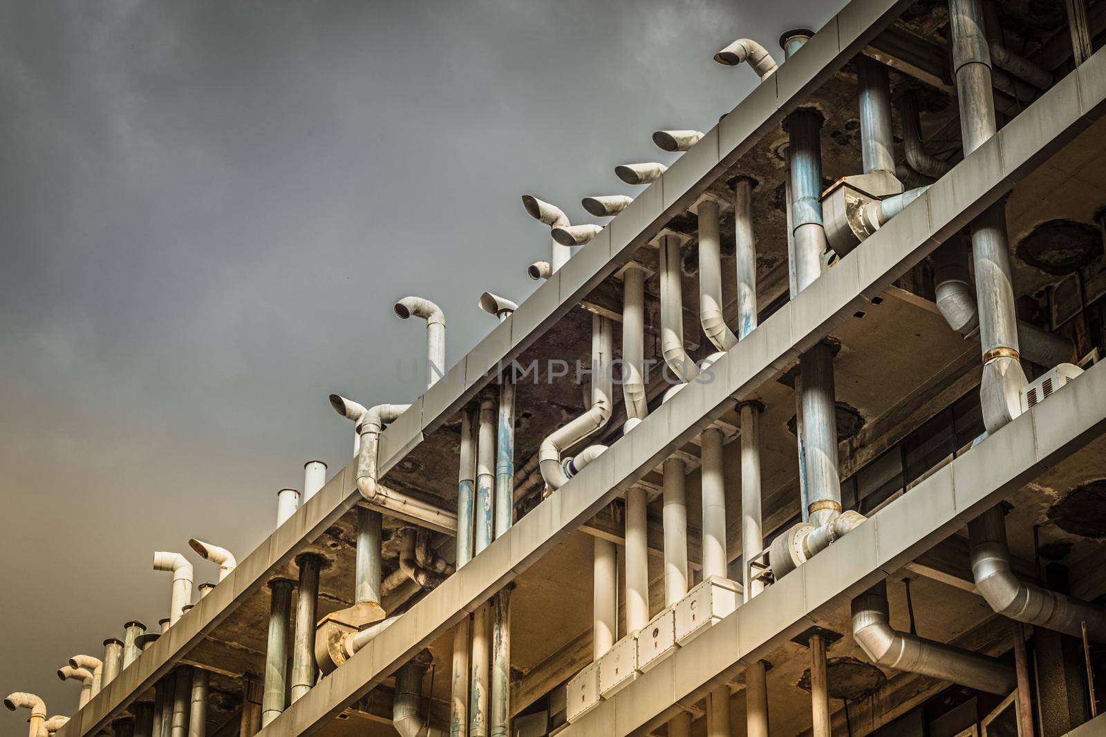 Air duct, air conditioner pipe on white ceiling wall. Ventilation system on the ceiling of large building