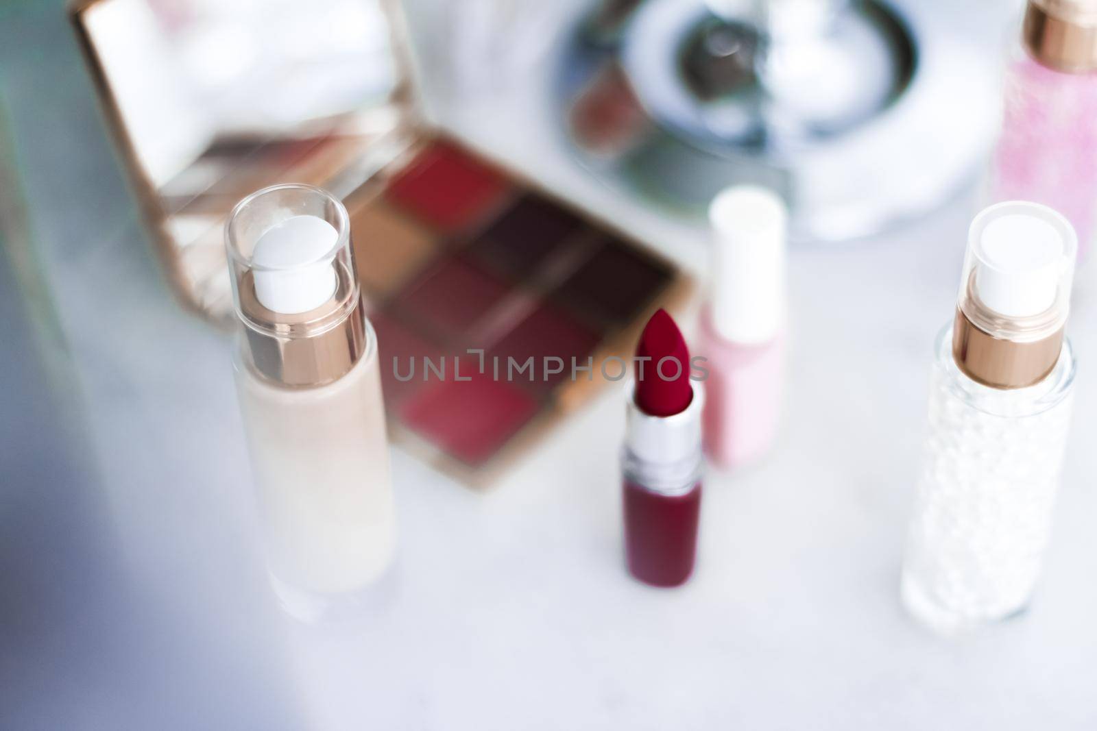 Cosmetic branding, girly and glamour concept - Cosmetics, makeup products on dressing vanity table, lipstick, foundation base, nailpolish and eyeshadows for luxury beauty and fashion brand ads design