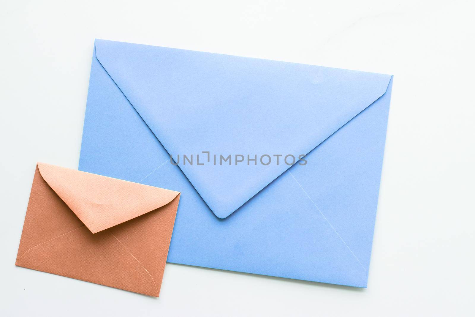 Postal service, newsletter and greeting card concept - Blank paper envelopes on marble flatlay background, holiday mail letter or post card message design
