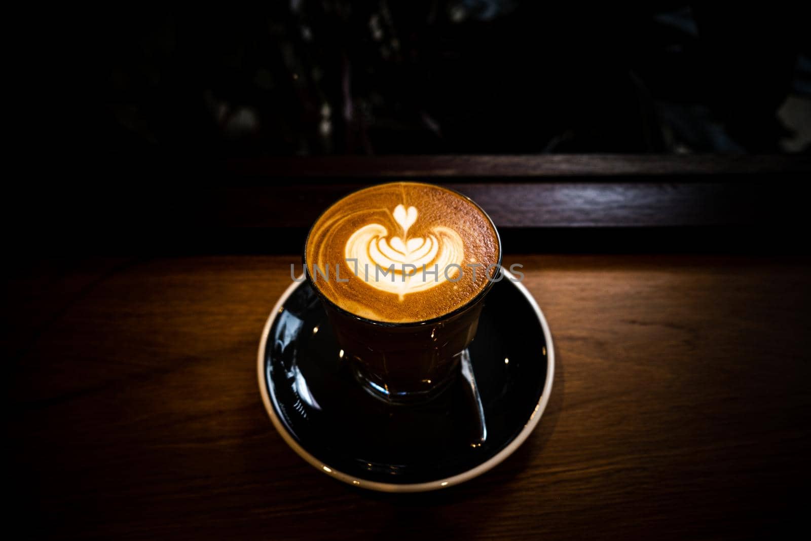 A cup of coffee latte top view with Microfoam milk leaf shape foam.