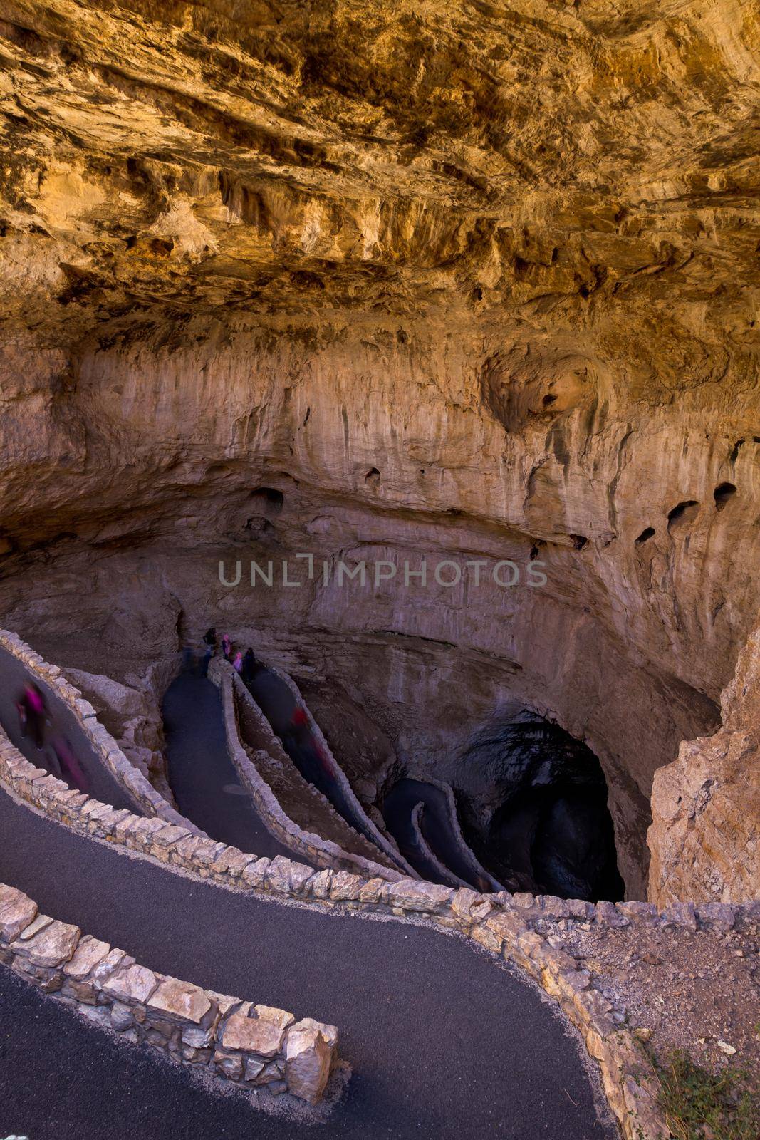 Switchback footpath winds into natural opening of Carlsbad Caverns.